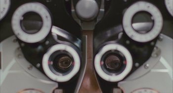 Movie still from “Deck the Halls” (2006), directed by John Whitesell – A pair of eye glasses sitting on top of a table; Extreme Close Up shot, Overhead angle