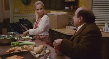 Movie still from “Deck the Halls” (2006), directed by John Whitesell – A woman standing next to a man at a table; Medium shot, Over the shoulder angle