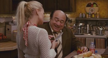 Movie still from “Deck the Halls” (2006), directed by John Whitesell – A man and a woman in a kitchen holding a knife; Medium shot, Over the shoulder angle