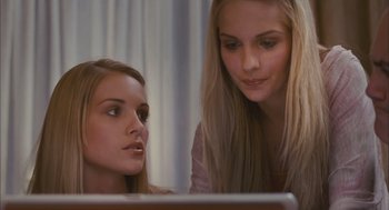Movie still from “Deck the Halls” (2006), directed by John Whitesell – Two young women looking at a computer screen; Close Up shot, Over the shoulder angle