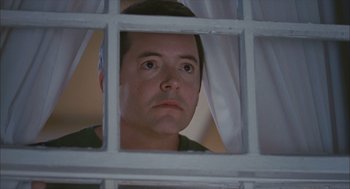 Movie still from “Deck the Halls” (2006), directed by John Whitesell – A man looking through a window at the camera; Close Up shot, Low angle