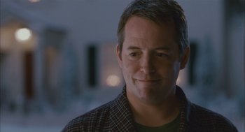Movie still from “Deck the Halls” (2006), directed by John Whitesell – A person wearing a plaid shirt; Close Up shot, Over the shoulder angle