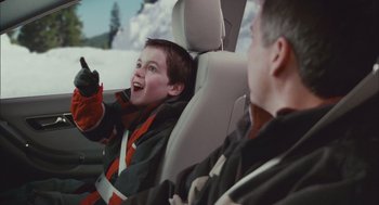 Movie still from “Deck the Halls” (2006), directed by John Whitesell – A man and a child in a car; Medium shot, Over the shoulder angle