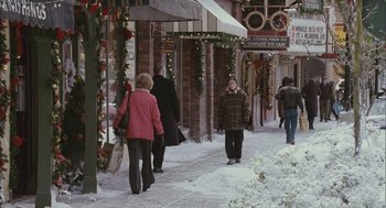 Movie still from “Deck the Halls” (2006), directed by John Whitesell – A group of people walking down a sidewalk; Wide shot, Over the shoulder angle