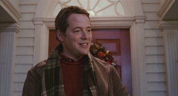 Movie still from “Deck the Halls” (2006), directed by John Whitesell – A man wearing a brown jacket and a plaid scarf; Close Up shot, Over the shoulder angle