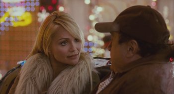 Movie still from “Deck the Halls” (2006), directed by John Whitesell – A man and a woman sitting next to each other in a car; Close Up shot, Over the shoulder angle