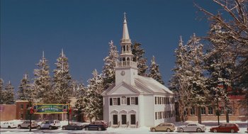 Movie still from “Deck the Halls” (2006), directed by John Whitesell – A church with a steeple in the middle of a snowy street; Extreme Wide shot, Low angle