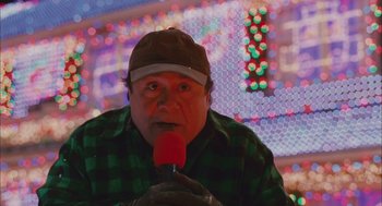 Movie still from “Deck the Halls” (2006), directed by John Whitesell – A man with a microphone in his mouth; Close Up shot, Low angle