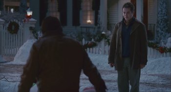 Movie still from “Deck the Halls” (2006), directed by John Whitesell – Two people walking on a sidewalk in front of a house; Medium shot, Over the shoulder angle