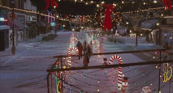 Movie still from “Deck the Halls” (2006), directed by John Whitesell – A group of people walking through a christmas light display; Extreme Wide shot, High angle