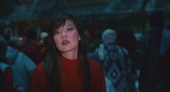 Movie still from “Deck the Halls” (2006), directed by John Whitesell – A woman in a red shirt is looking at the camera; Medium shot, Low angle