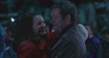 Movie still from “Deck the Halls” (2006), directed by John Whitesell – A man and a woman smiling at each other; Close Up shot, Low angle
