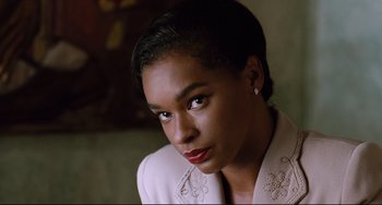 Movie still from “Deep Cover” (1992), directed by Bill Duke – A person with short hair; Close Up shot, Low angle