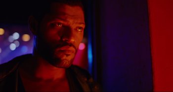 Movie still from “Deep Cover” (1992), directed by Bill Duke – A person wearing a leather jacket; Close Up shot, Low angle