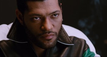 Movie still from “Deep Cover” (1992), directed by Bill Duke – A person wearing a leather jacket; Close Up shot, High angle