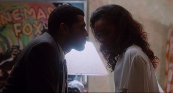 Movie still from “Deep Cover” (1992), directed by Bill Duke – A man and a woman face to face in a room; Medium shot, Over the shoulder angle