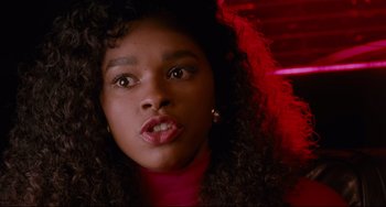 Movie still from “Deep Cover” (1992), directed by Bill Duke – A person with curly black hair; Close Up shot, Low angle