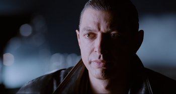 Movie still from “Deep Cover” (1992), directed by Bill Duke – A person wearing a leather jacket; Close Up shot, Low angle