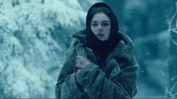 Movie still from “Defiance” (2008), directed by Edward Zwick – A young woman in a fur coat and a hood; Medium shot, Low angle