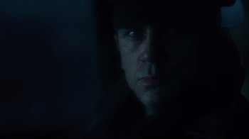 Movie still from “Defiance” (2008), directed by Edward Zwick – A person in a dark room; Close Up shot, Low angle