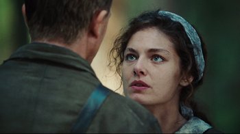 Movie still from “Defiance” (2008), directed by Edward Zwick – A man and a woman looking at one another; Close Up shot, Over the shoulder angle