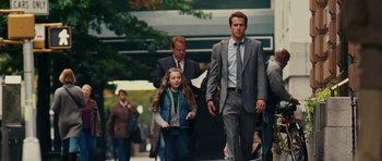 Movie still from “Definitely, Maybe” (2008), directed by Adam Brooks – A group of people walking down a street; Medium shot, Over the shoulder angle