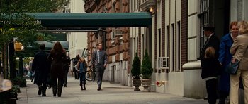 Movie still from “Definitely, Maybe” (2008), directed by Adam Brooks – A man in a business suit walking down the street; Wide shot, Over the shoulder angle