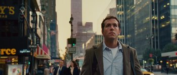 Movie still from “Definitely, Maybe” (2008), directed by Adam Brooks – A man is walking down the street in the city; Medium shot, Low angle