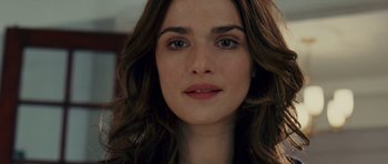 Movie still from “Definitely, Maybe” (2008), directed by Adam Brooks – A woman's face with long brown hair; Close Up shot, Over the shoulder angle