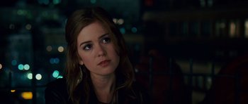 Movie still from “Definitely, Maybe” (2008), directed by Adam Brooks – A person wearing a black jacket; Close Up shot, Over the shoulder angle