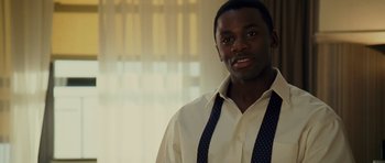 Movie still from “Definitely, Maybe” (2008), directed by Adam Brooks – A man in a white dress shirt and blue tie; Close Up shot, Over the shoulder angle