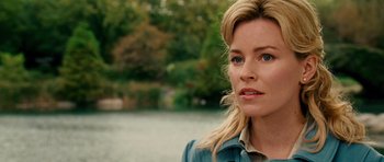 Movie still from “Definitely, Maybe” (2008), directed by Adam Brooks – A person wearing a blue shirt near a body of water; Close Up shot, Over the shoulder angle