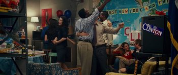 Movie still from “Definitely, Maybe” (2008), directed by Adam Brooks – Two men hugging each other in front of a group of people; Wide shot, Over the shoulder angle