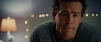 Movie still from “Definitely, Maybe” (2008), directed by Adam Brooks – A man's face in front of the lights; Close Up shot, Over the shoulder angle