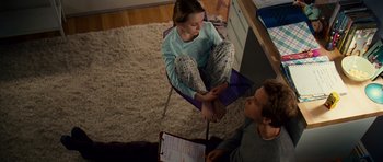 Movie still from “Definitely, Maybe” (2008), directed by Adam Brooks – A man and a girl sitting on a chair; Wide shot, High angle