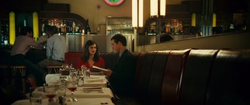 Movie still from “Definitely, Maybe” (2008), directed by Adam Brooks – A man and a woman sitting at a restaurant table; Medium shot, Over the shoulder angle