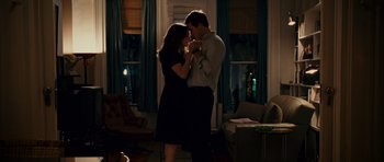 Movie still from “Definitely, Maybe” (2008), directed by Adam Brooks – A man and a woman dancing in a living room; Medium shot, Low angle