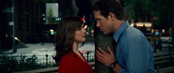 Movie still from “Definitely, Maybe” (2008), directed by Adam Brooks – A man and a woman standing next to a tree; Medium shot, Over the shoulder angle