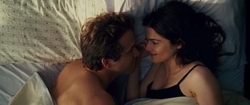 Movie still from “Definitely, Maybe” (2008), directed by Adam Brooks – A man and a woman laying in a bed together; Close Up shot, Overhead angle