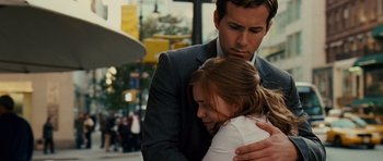 Movie still from “Definitely, Maybe” (2008), directed by Adam Brooks – A man and a woman hugging on a city street; Close Up shot, Over the shoulder angle