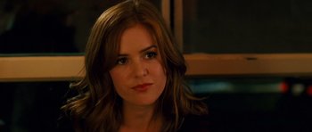 Movie still from “Definitely, Maybe” (2008), directed by Adam Brooks – A person with long brown hair; Close Up shot, Over the shoulder angle