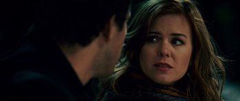 Movie still from “Definitely, Maybe” (2008), directed by Adam Brooks – A man and a woman looking at one another; Close Up shot, Over the shoulder angle