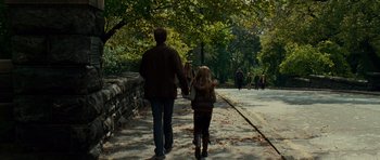 Movie still from “Definitely, Maybe” (2008), directed by Adam Brooks – A man and a little girl walking down a sidewalk; Wide shot, Over the shoulder angle