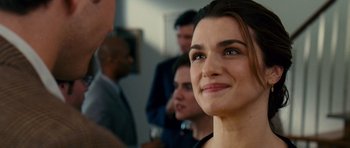 Movie still from “Definitely, Maybe” (2008), directed by Adam Brooks – A woman smiling at the camera; Close Up shot, Over the shoulder angle