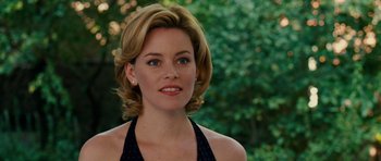 Movie still from “Definitely, Maybe” (2008), directed by Adam Brooks – A person with short hair; Close Up shot, Over the shoulder angle