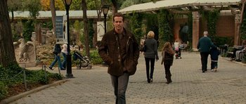 Movie still from “Definitely, Maybe” (2008), directed by Adam Brooks – A man walking down the street with his hands in his pockets; Wide shot, Over the shoulder angle