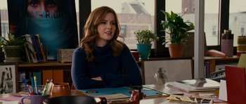 Movie still from “Definitely, Maybe” (2008), directed by Adam Brooks – A woman sitting at a table in front of a window; Medium shot, Over the shoulder angle