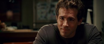 Movie still from “Definitely, Maybe” (2008), directed by Adam Brooks – A person sitting in front of a window; Close Up shot, Over the shoulder angle