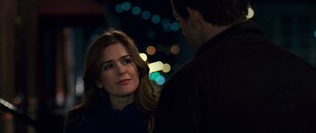 Movie still from “Definitely, Maybe” (2008), directed by Adam Brooks – A man and a woman standing next to each other in the dark; Close Up shot, Over the shoulder angle