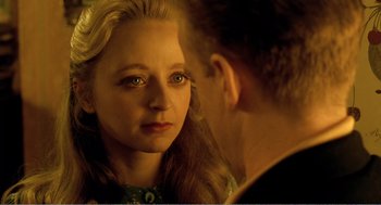 Movie still from “Delicatessen” (1991), directed by Marc Caro – A man and a woman looking at one another in a mirror; Close Up shot, Over the shoulder angle